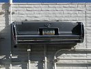Cadillac on back of 3434 E. Broadway